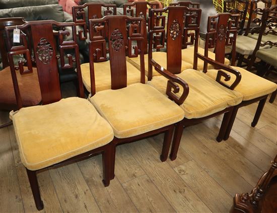 Seven Chinese hardwood dining chairs (one with arms)